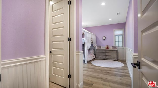 bathroom with hardwood / wood-style floors