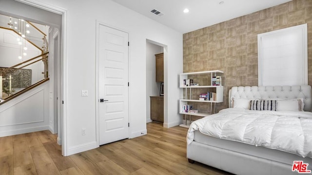 bedroom with light hardwood / wood-style floors