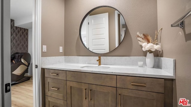 bathroom featuring hardwood / wood-style floors and vanity