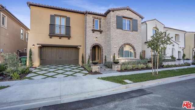 mediterranean / spanish-style house featuring a garage