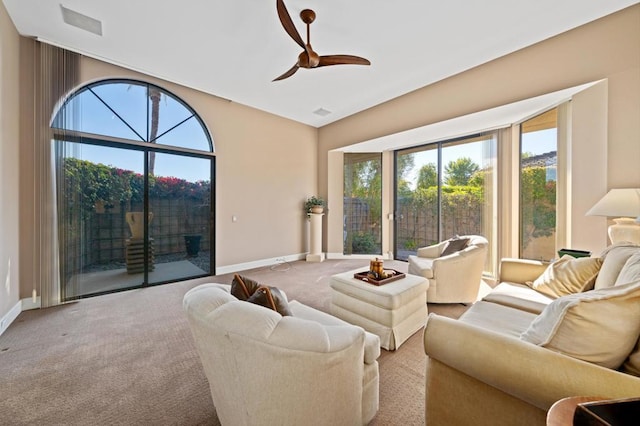 living room with ceiling fan and light carpet