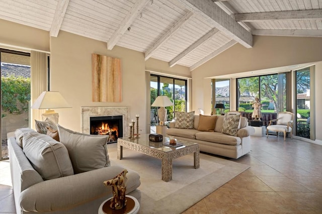 tiled living room with high vaulted ceiling, wooden ceiling, beam ceiling, and a fireplace