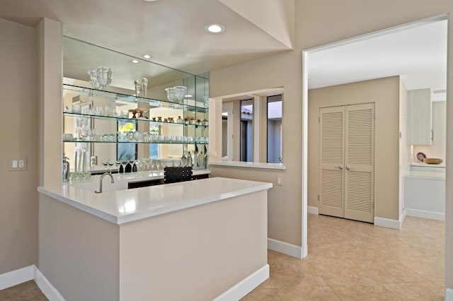 bar with light tile patterned floors