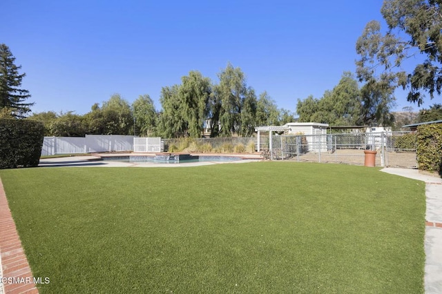 view of yard with a fenced in pool