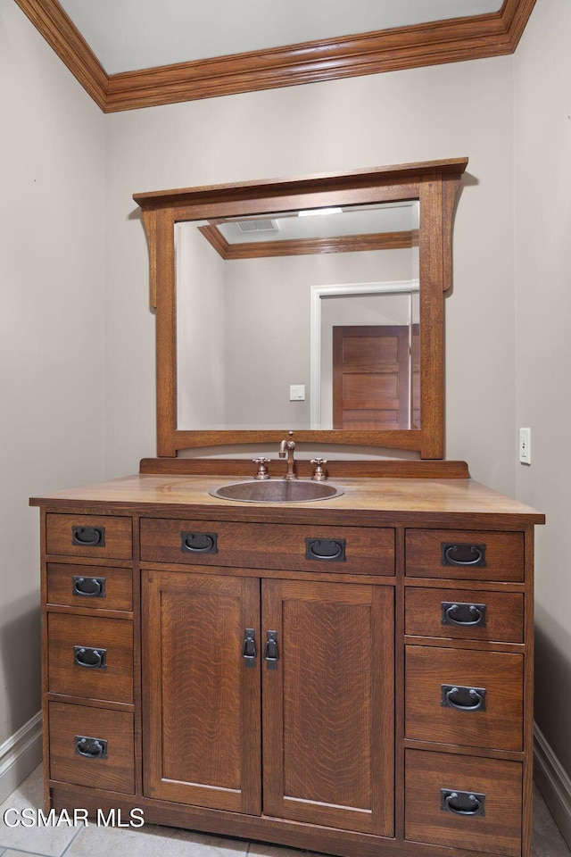 bathroom featuring vanity and crown molding