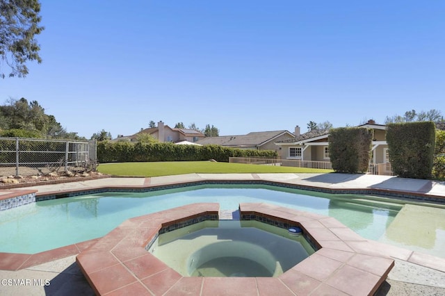 view of pool featuring an in ground hot tub and a lawn