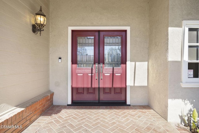 entrance to property featuring french doors