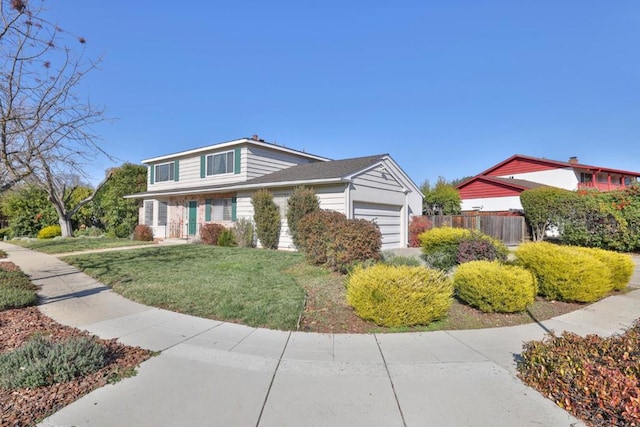 view of front facade with a front yard and a garage