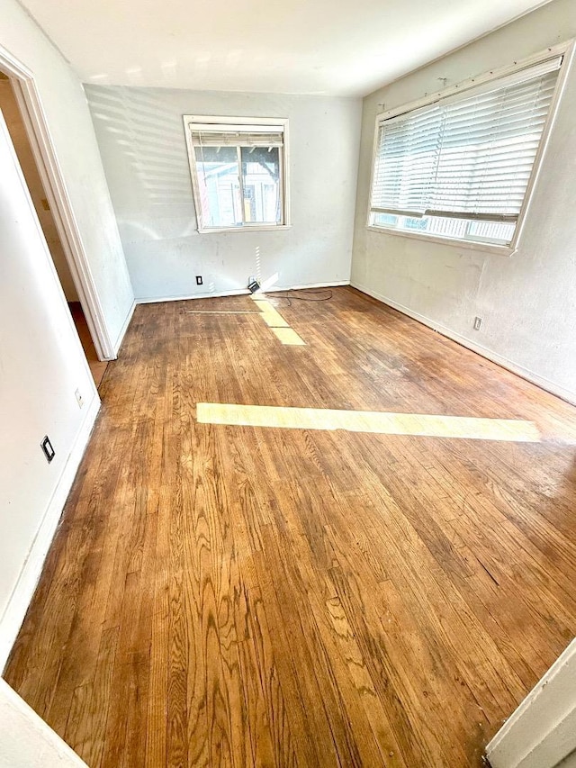 empty room featuring wood-type flooring