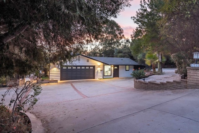 single story home with a garage