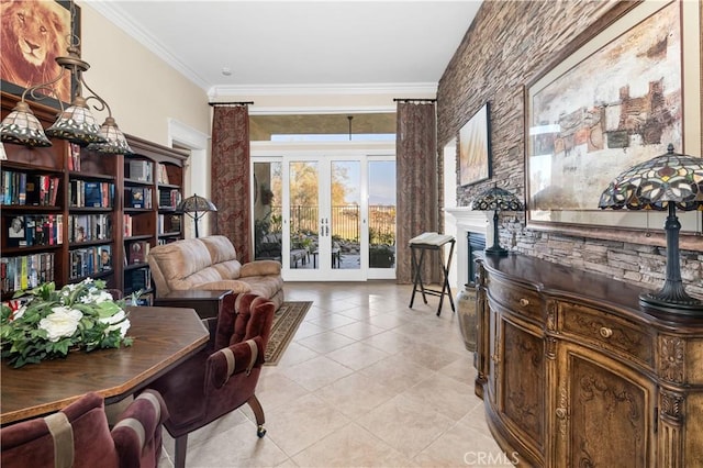 living area featuring ornamental molding, light tile patterned floors, and french doors