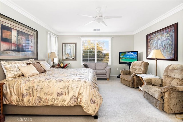 carpeted bedroom featuring ceiling fan and ornamental molding