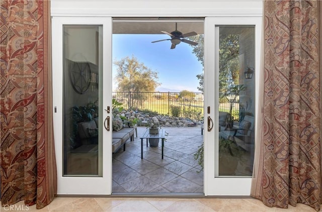 entryway featuring light tile patterned flooring, ceiling fan, and french doors