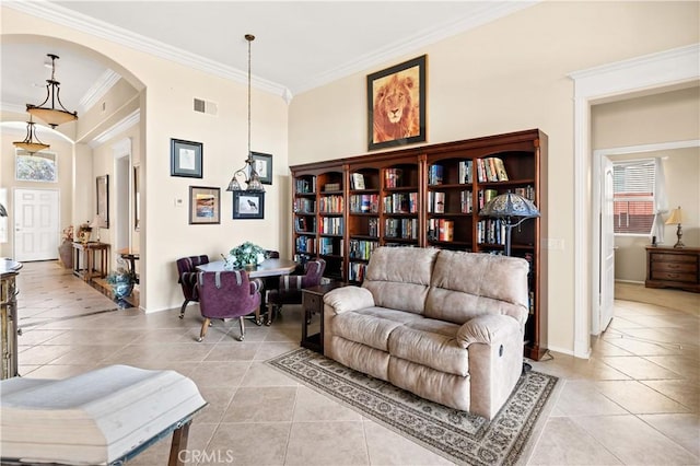 living area with light tile patterned flooring and ornamental molding