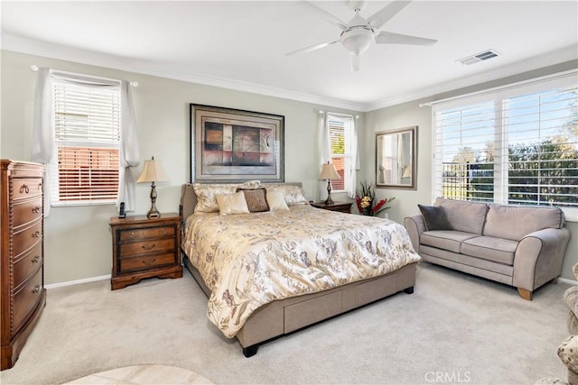 carpeted bedroom with crown molding and ceiling fan