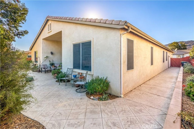 view of property exterior featuring a patio