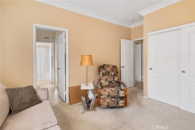 living area featuring crown molding and light colored carpet