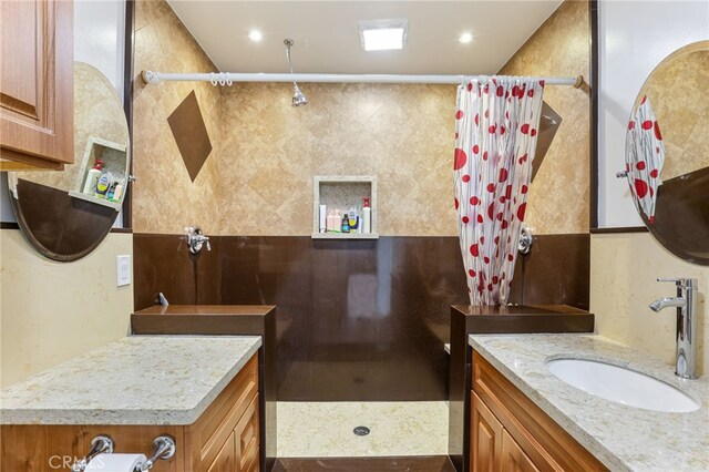 bathroom featuring vanity and a shower with curtain