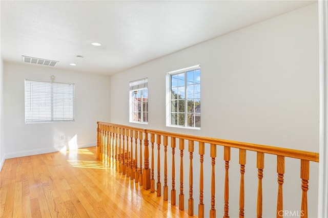 corridor featuring light hardwood / wood-style floors