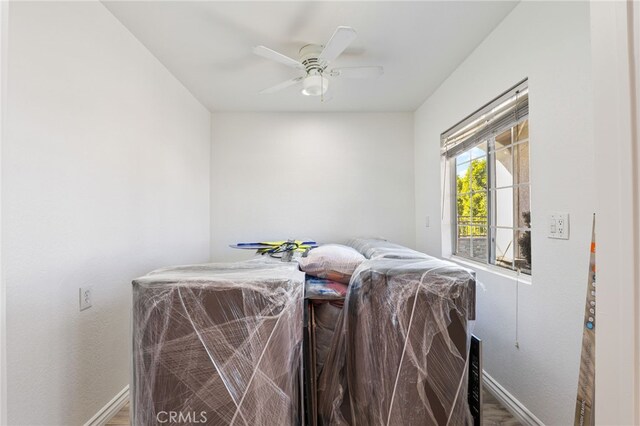 interior space with ceiling fan and hardwood / wood-style flooring