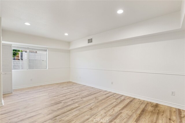 empty room with light hardwood / wood-style floors