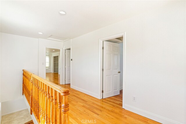 corridor featuring hardwood / wood-style flooring