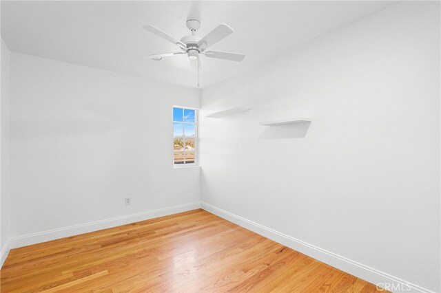 unfurnished room featuring ceiling fan and light wood-type flooring