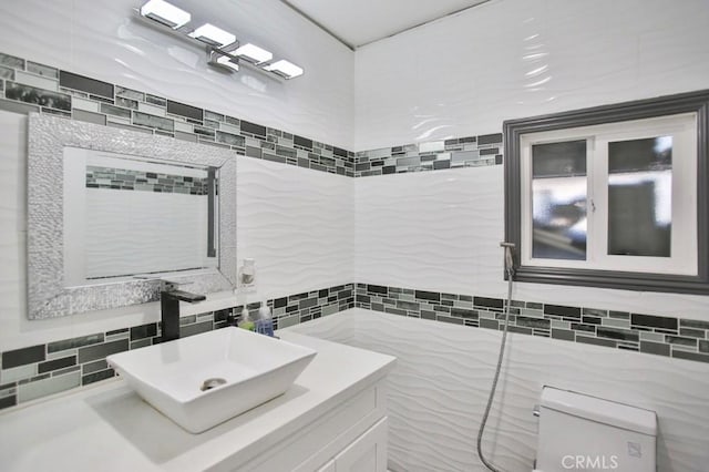 bathroom featuring tile walls and vanity