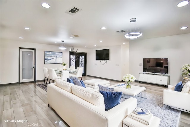 living room with light hardwood / wood-style flooring