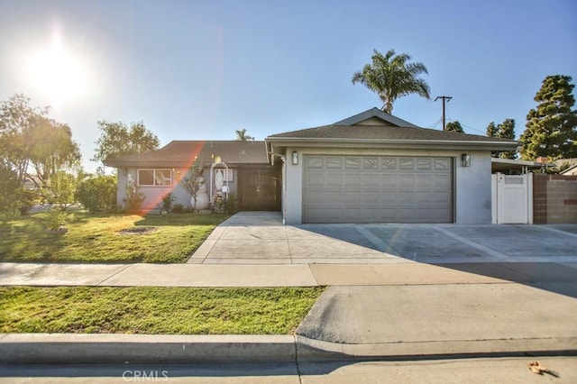 view of front facade with a garage and a front lawn