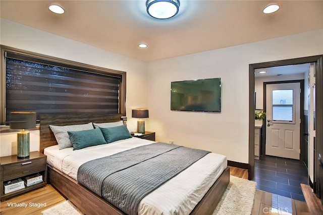 bedroom featuring dark hardwood / wood-style floors