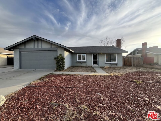 ranch-style home featuring a garage