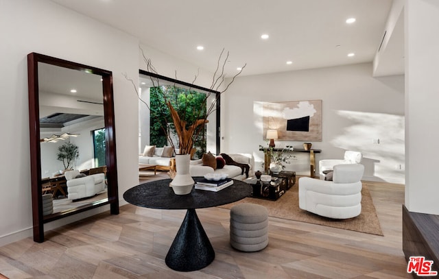 sitting room featuring plenty of natural light and light hardwood / wood-style floors