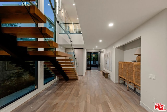 staircase featuring wood-type flooring