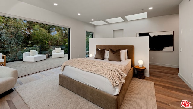 bedroom with hardwood / wood-style floors