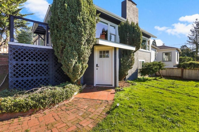 rear view of house with a yard