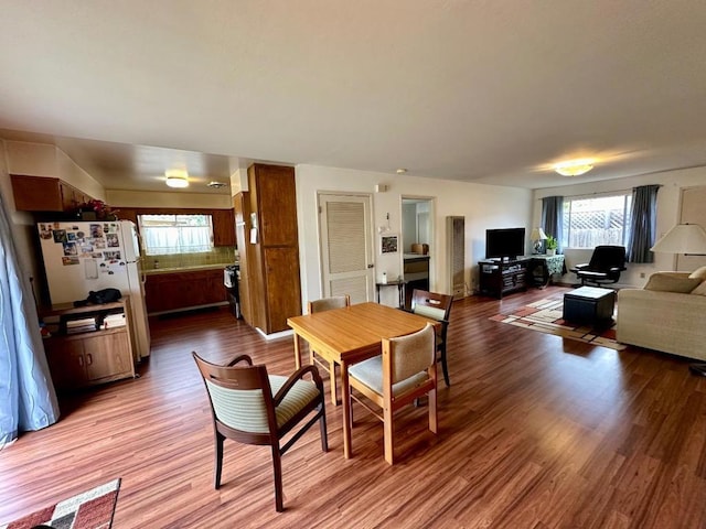 dining area featuring plenty of natural light and hardwood / wood-style floors