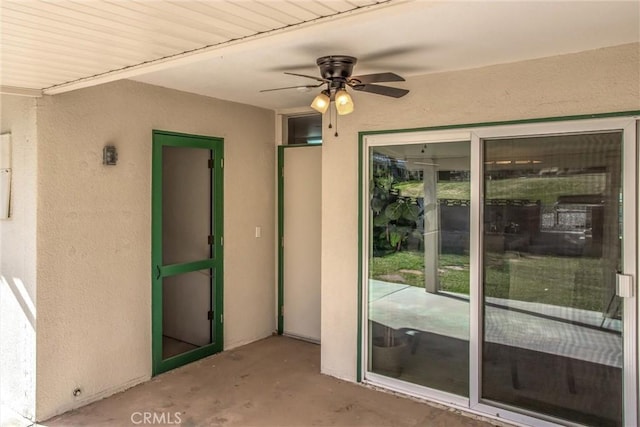 exterior space featuring ceiling fan and a patio area