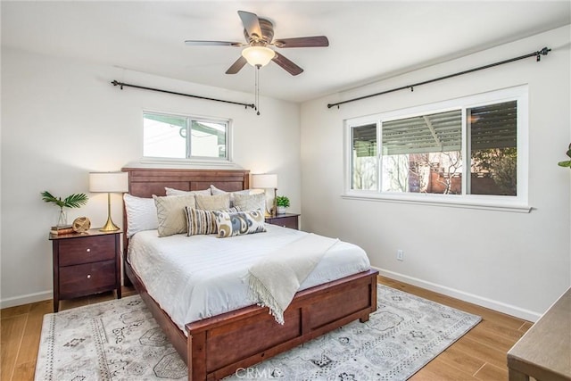 bedroom featuring ceiling fan and light hardwood / wood-style floors