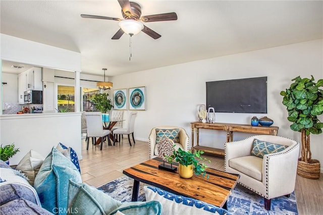 living room with ceiling fan