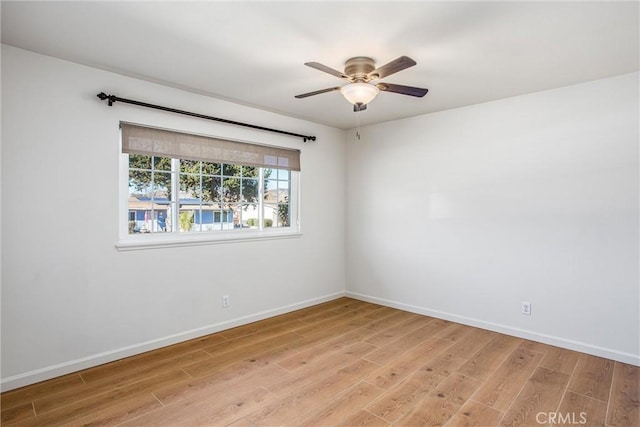 spare room with ceiling fan and light hardwood / wood-style flooring