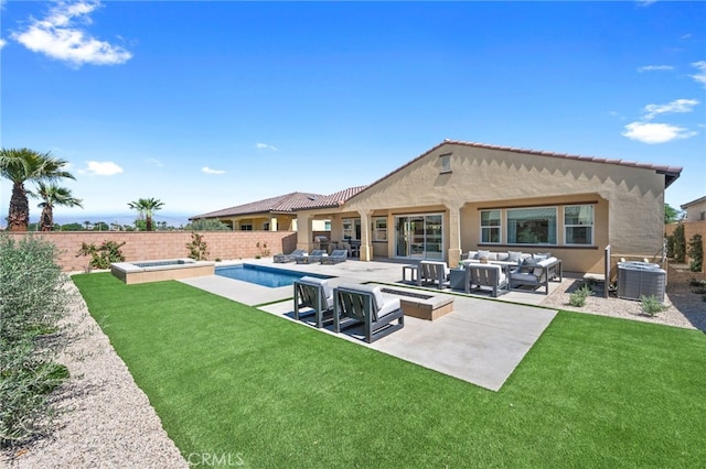 rear view of property featuring an outdoor living space, cooling unit, a fenced in pool, a patio, and a lawn