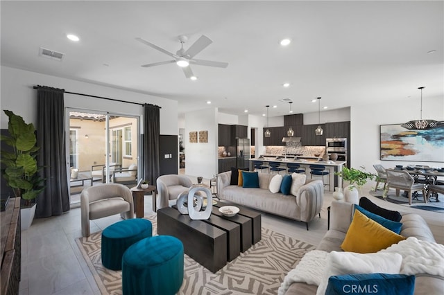 living room featuring ceiling fan