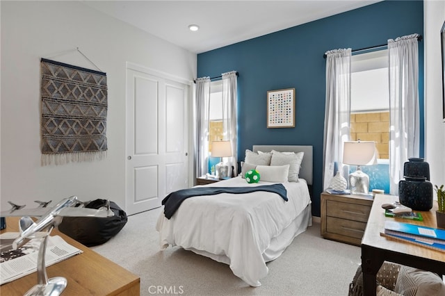 carpeted bedroom with a closet