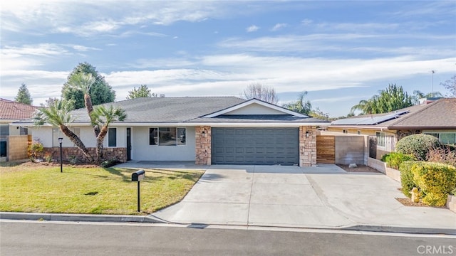 ranch-style home featuring a garage and a front yard