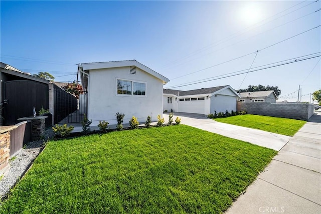 view of front of property with a garage and a front yard