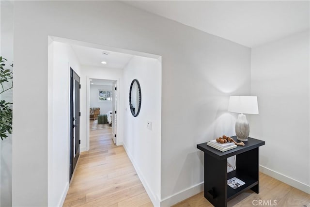 hallway with light wood-type flooring