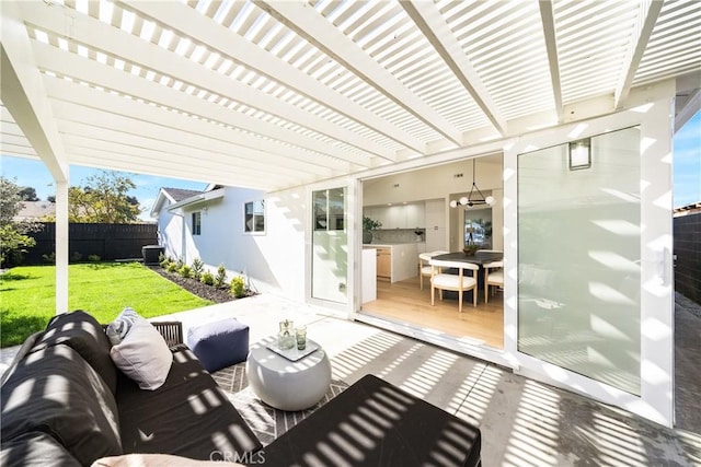 view of patio / terrace with central AC unit, an outdoor kitchen, and an outdoor hangout area