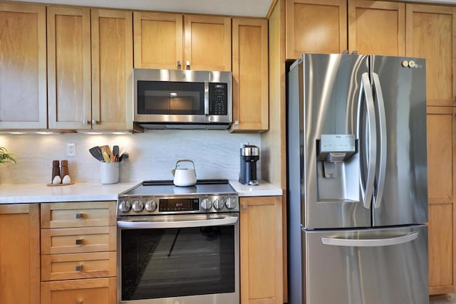 kitchen with backsplash and stainless steel appliances