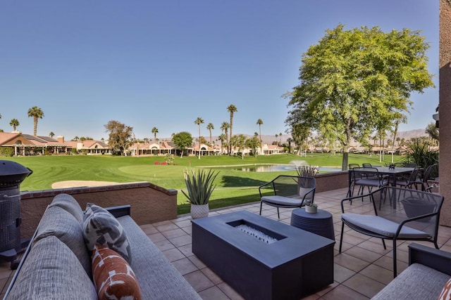 view of patio featuring a grill and a fire pit